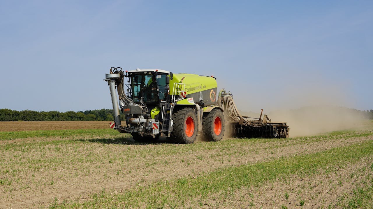 Modern farming machinery working in a field in Geesthacht, capturing agricultural technology in action.